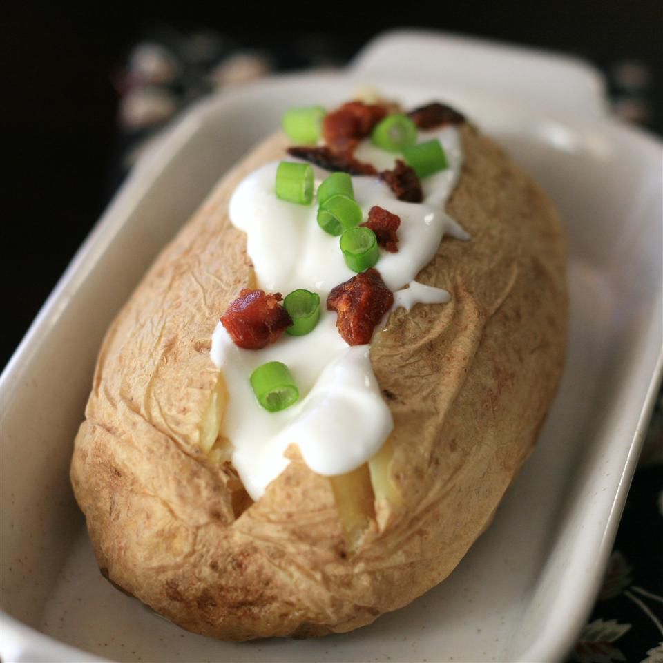 Microwave Baked Potato topped with sour cream and bacon