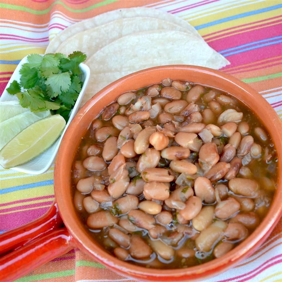 Instant Pot&reg; Charro (Refried Beans) in an orange bowl