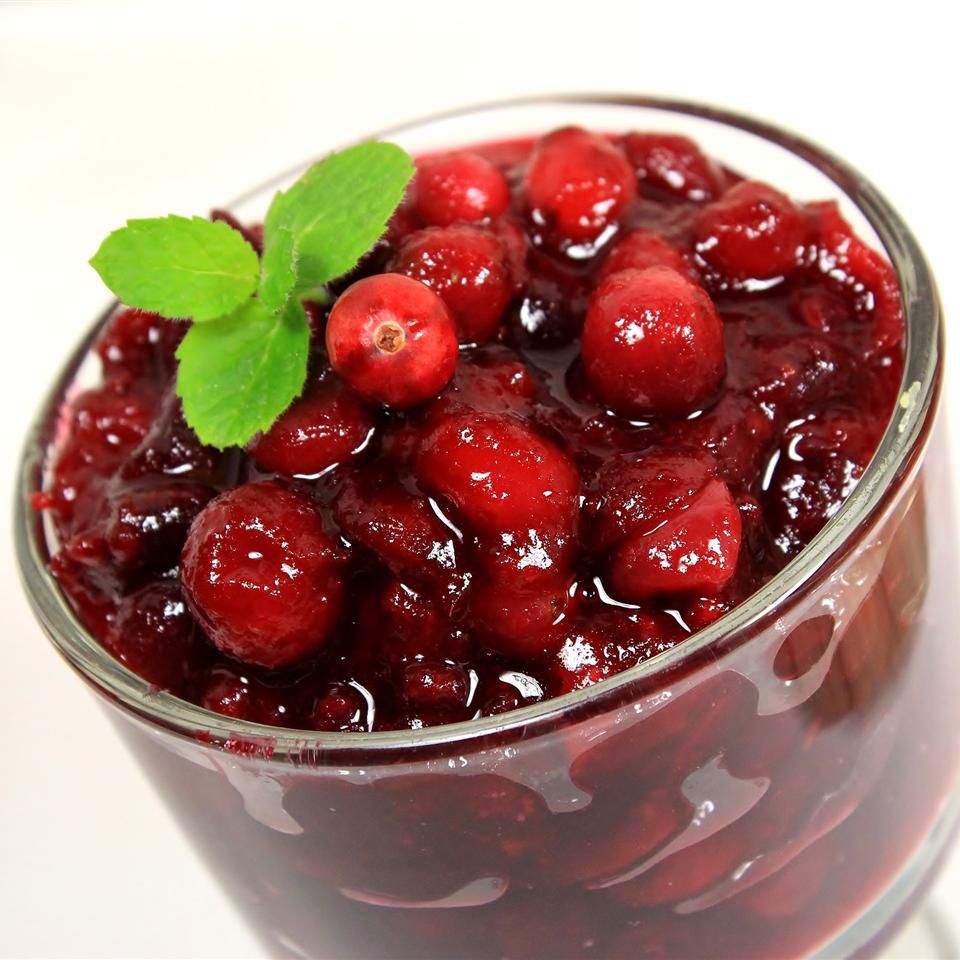 cranberry sauce with whole cranberries in a glass container