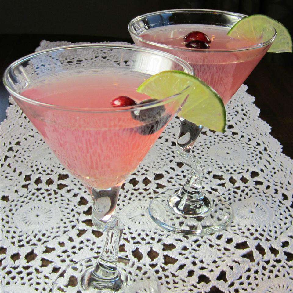 Two Cosmopolitan Cocktails on white doilies