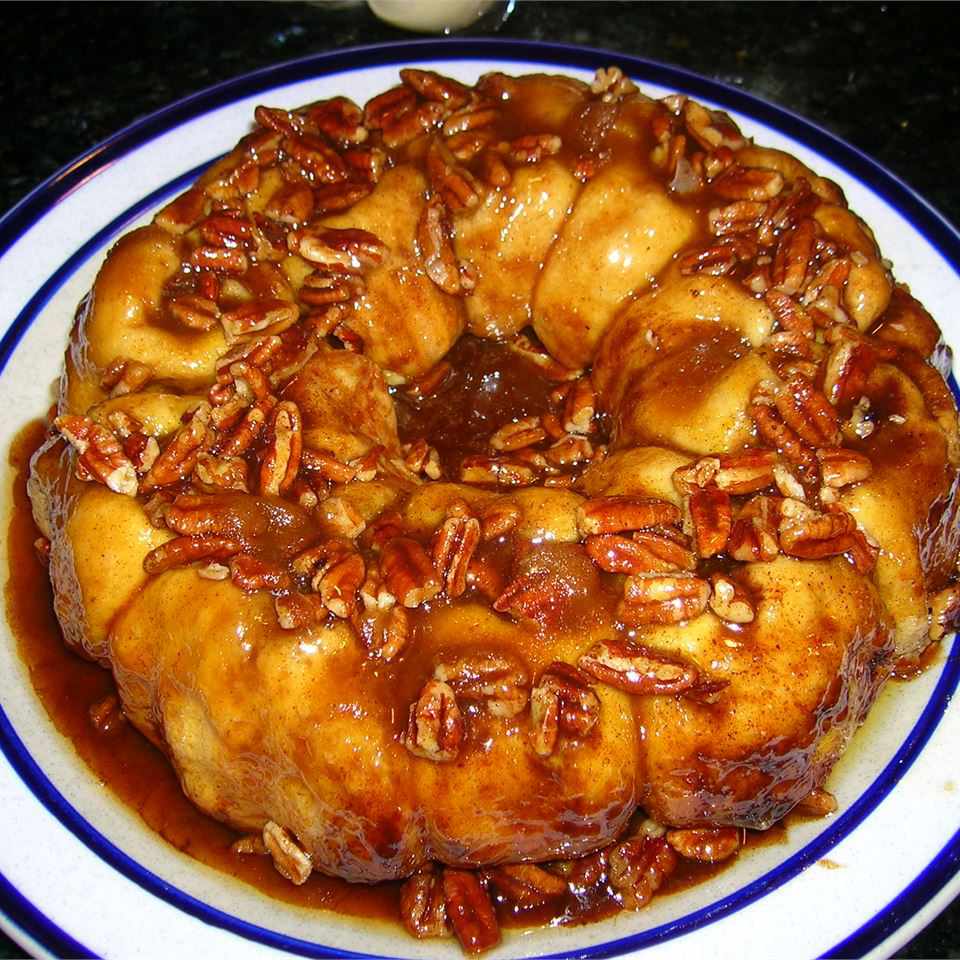 a pan of Marcia's Famous Sticky Buns flipped out onto a white plate