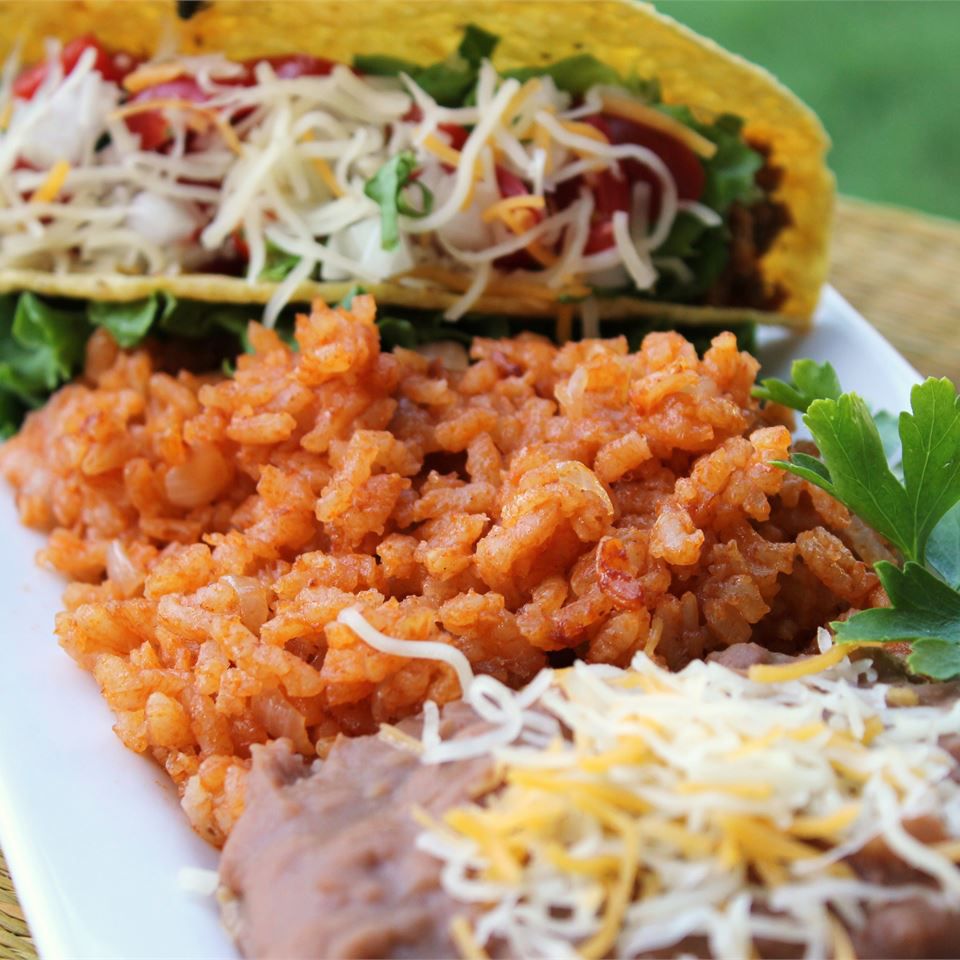 tacos, rice, and beans on a platter