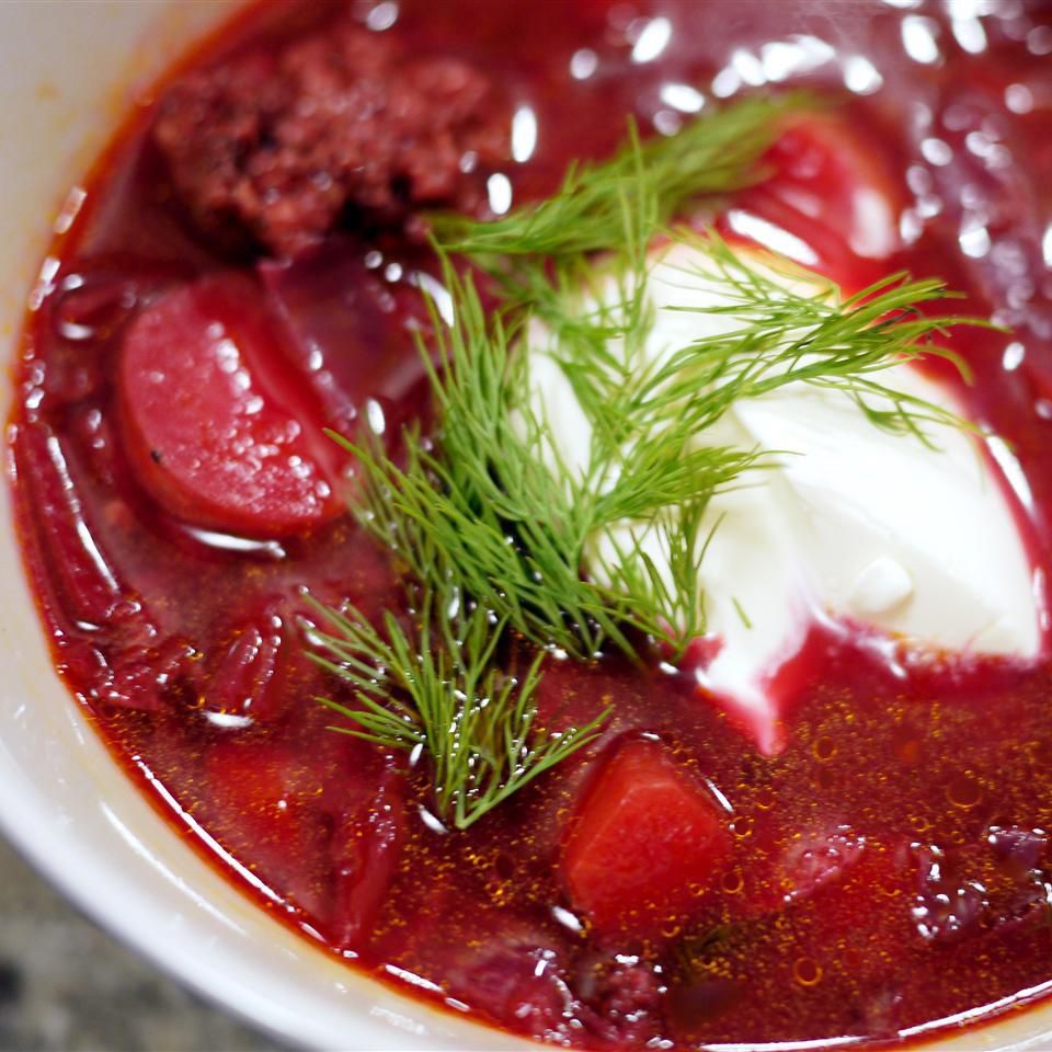 bowl of beet soup with sour cream and dill