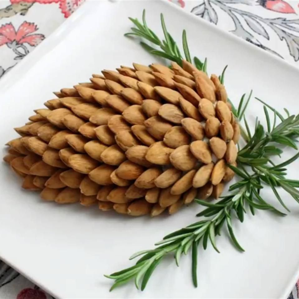 cheese ball shaped like a pine cone with almonds