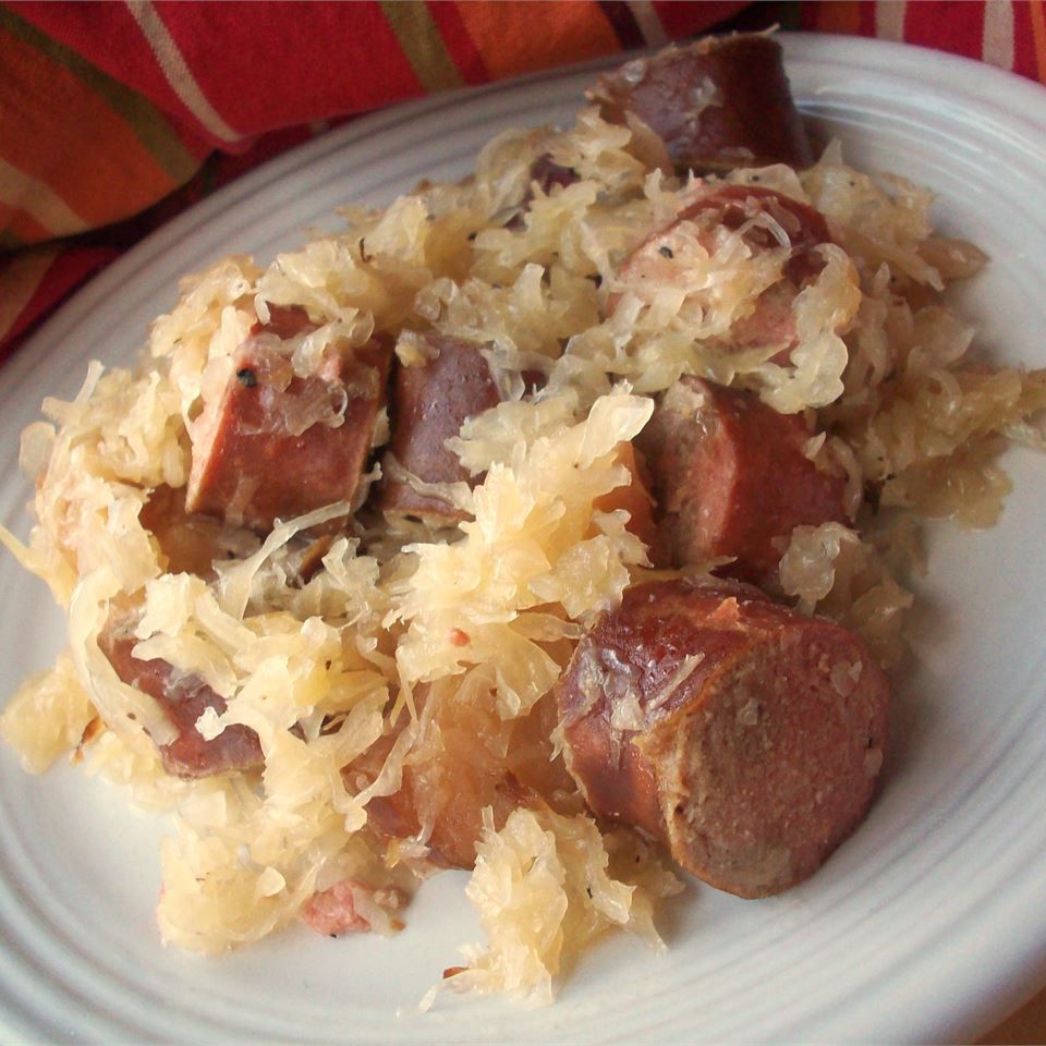 a plate of kielbasa pieces and sauerkraut
