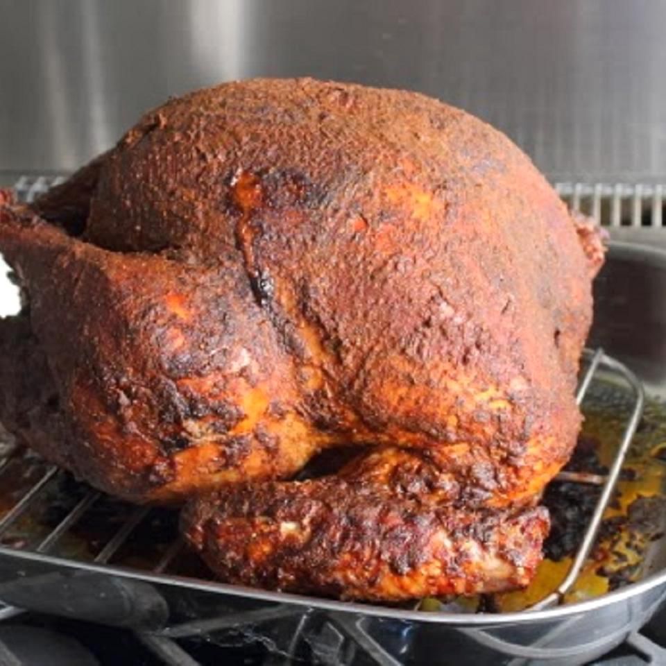 Peruvian-style whole roasted turkey on a pan