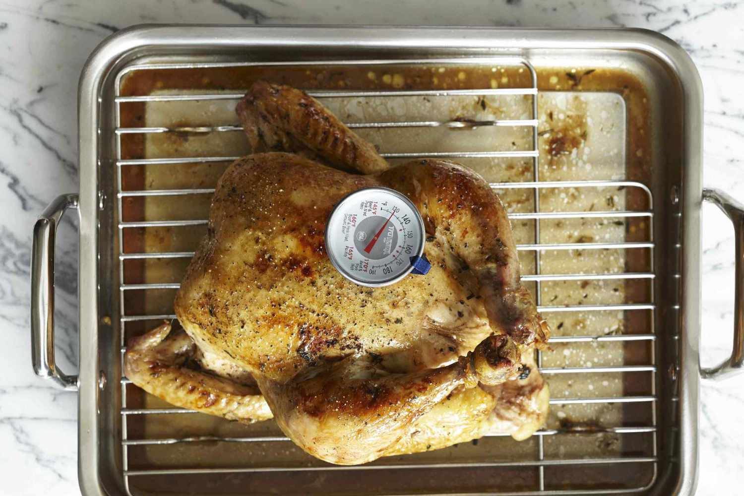 Roast turkey on roasting rack with thermometer inside