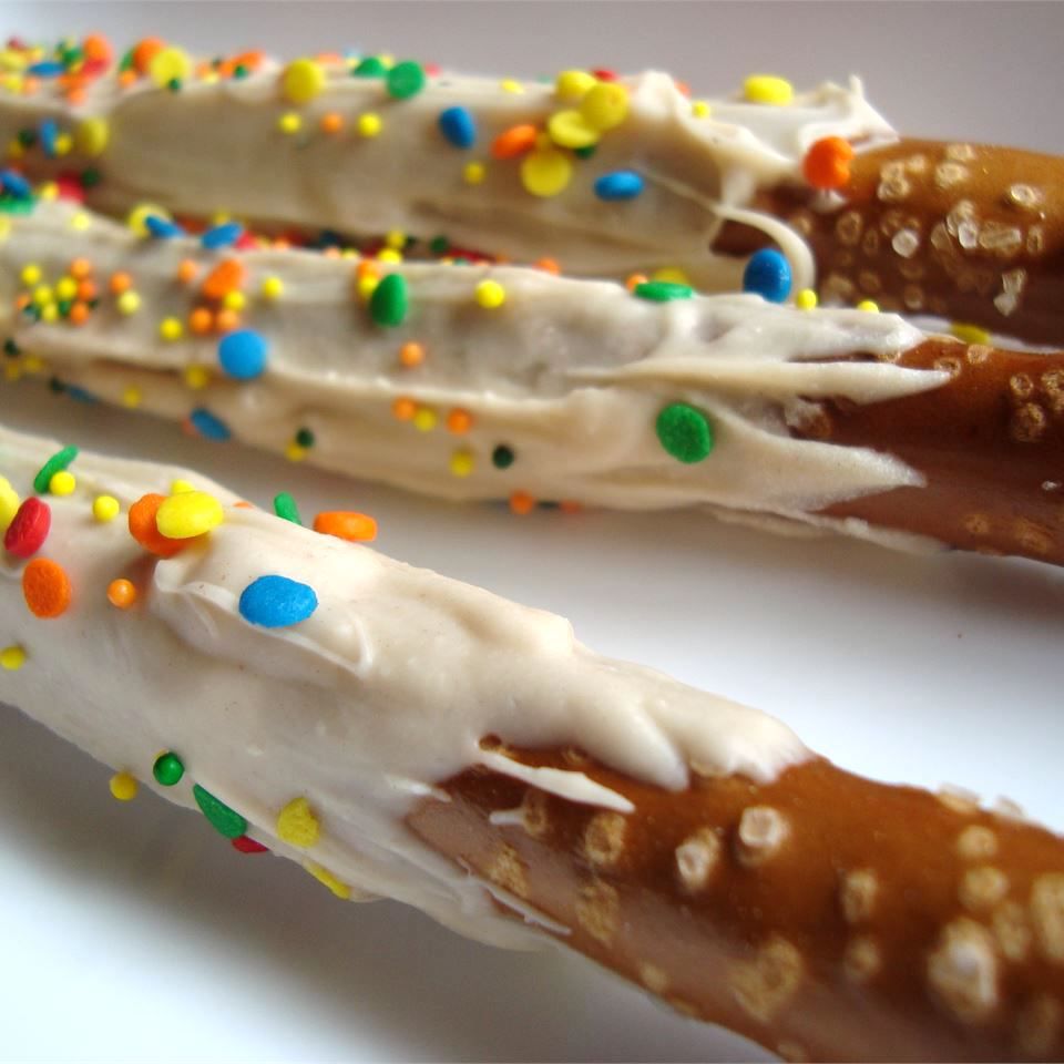 pretzel magic wands with frosting and sprinkles