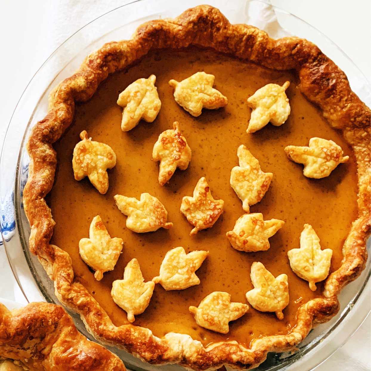 pumpkin pie with pastry leaf cutouts on top