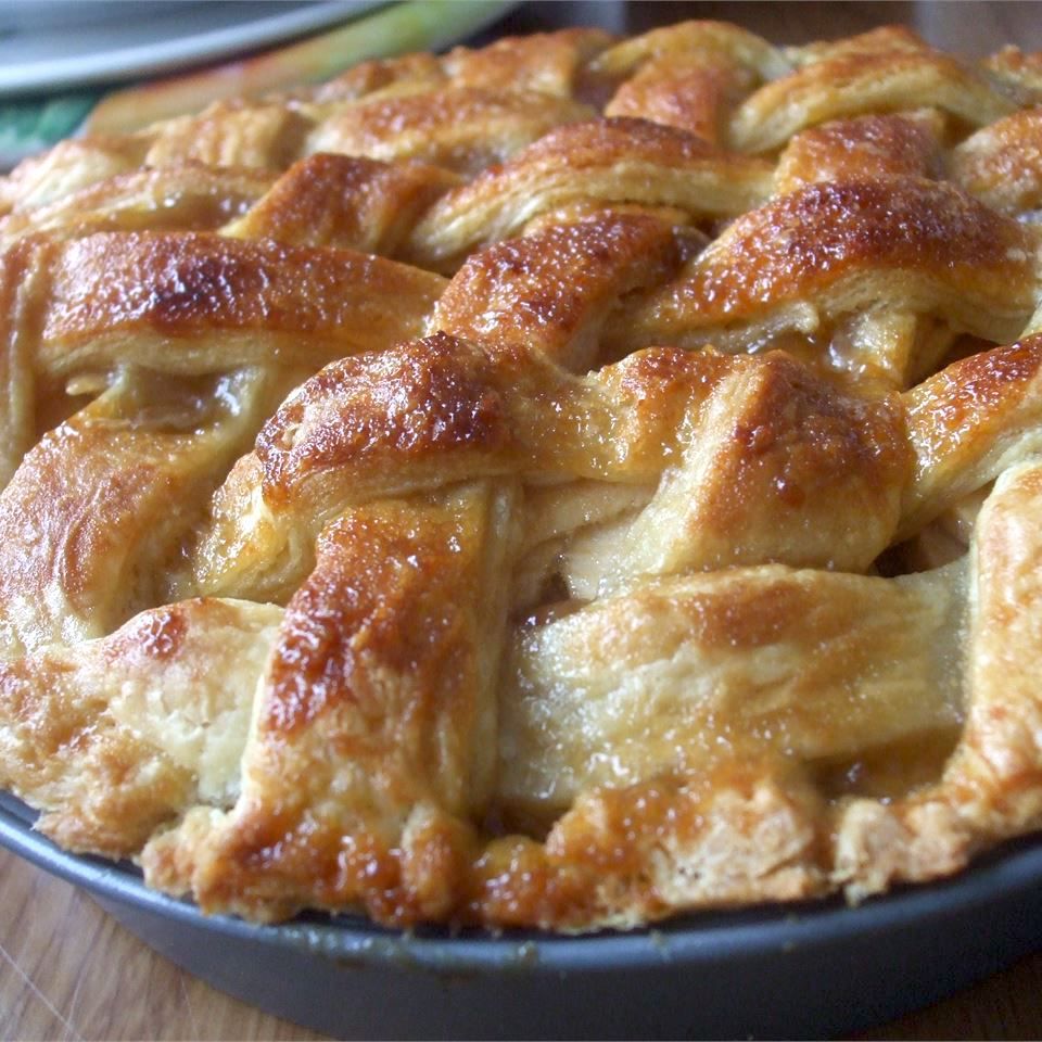a lattice-topped apple pie with a flaky-looking golden brown crust