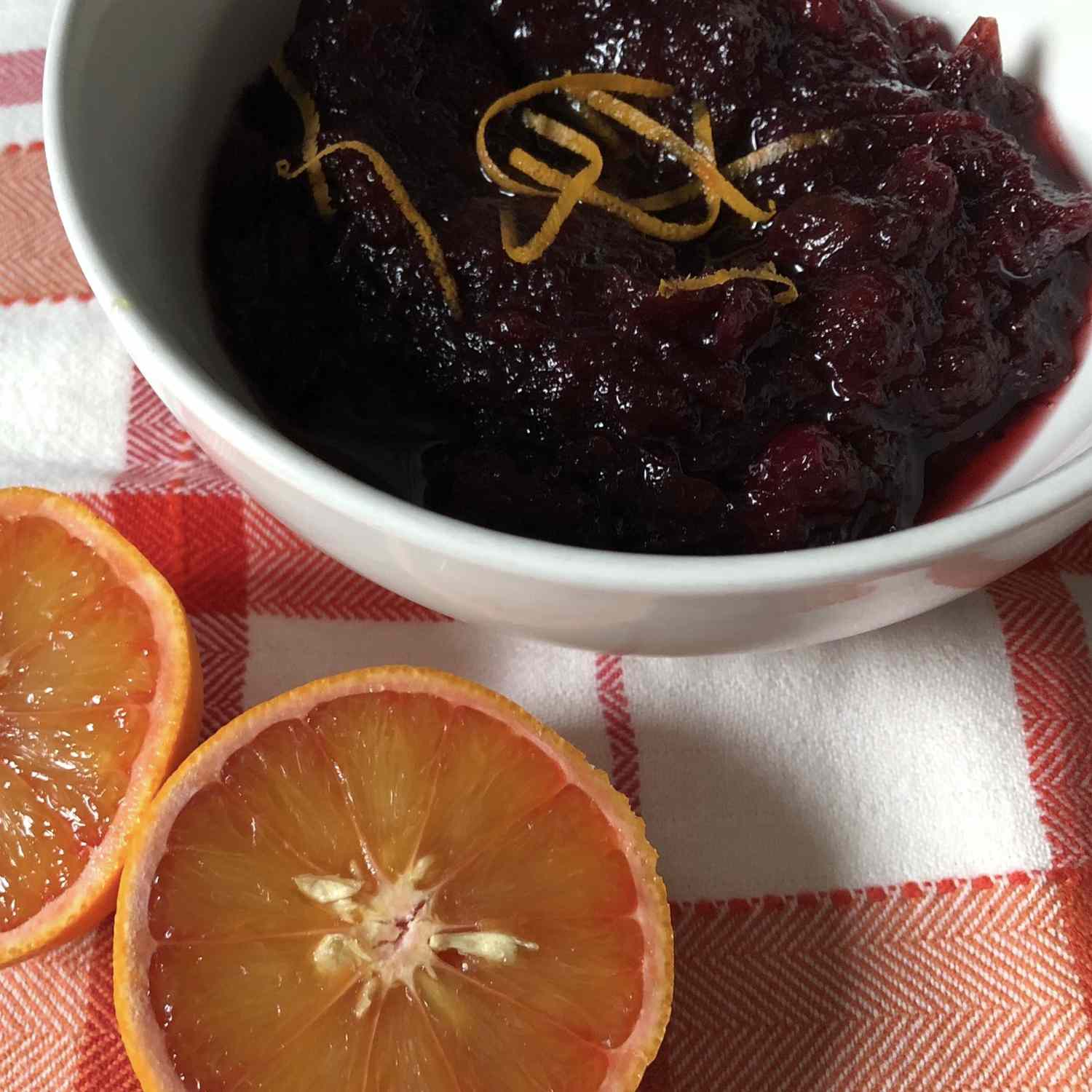 bowl of cranberry sauce with an orange
