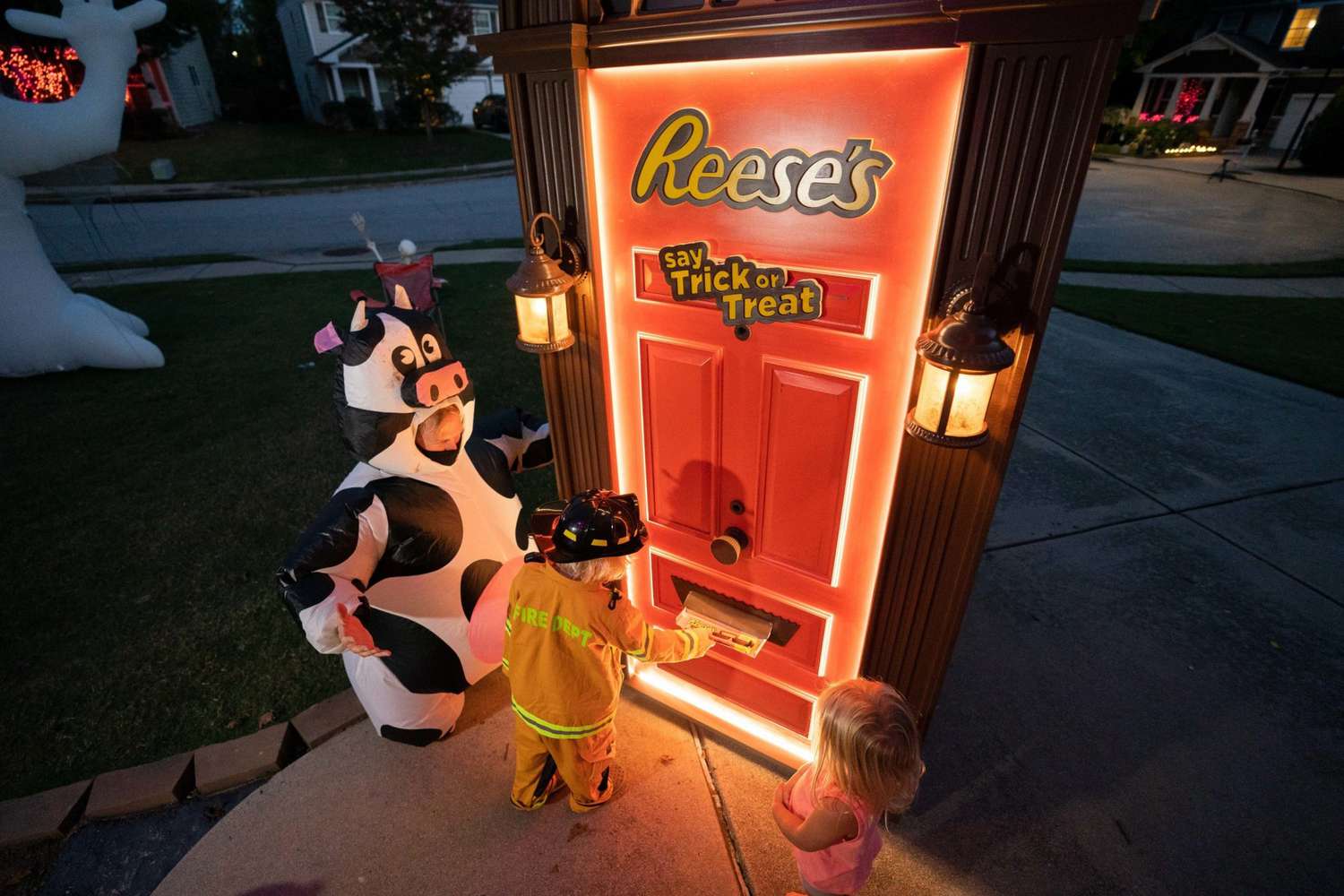 reeses trick or treating door dispenses candy