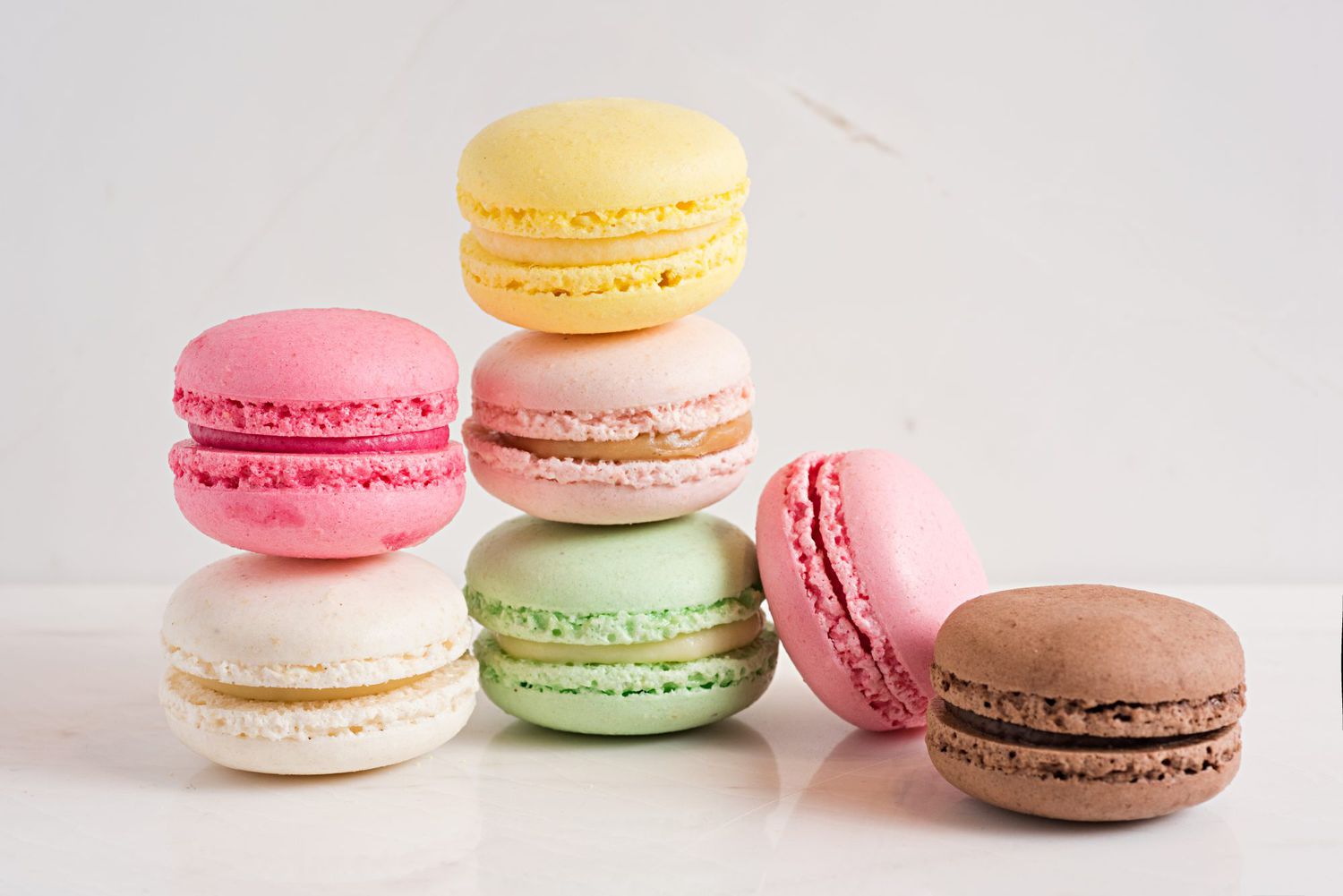 colorful macarons on a white background
