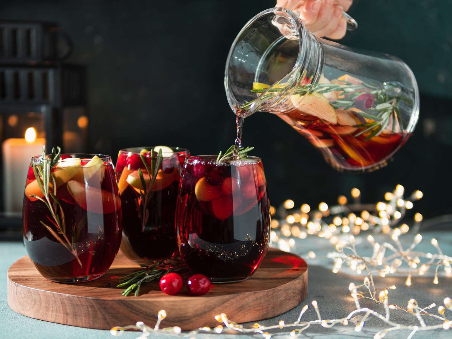 Winter sangria pouring in glasses, christmas table