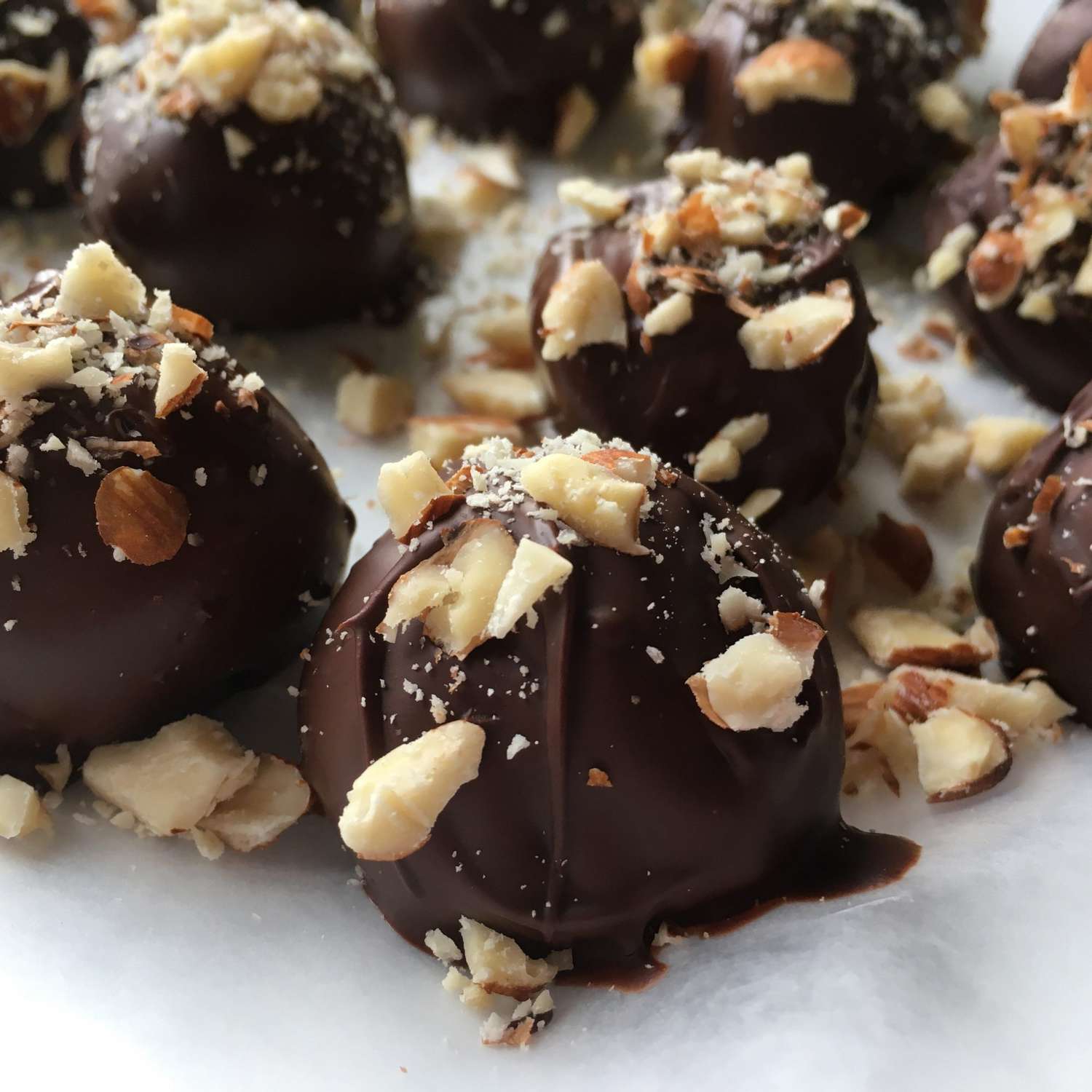 5-Ingredient Keto and Vegan Chocolate Almond Balls on parchment paper