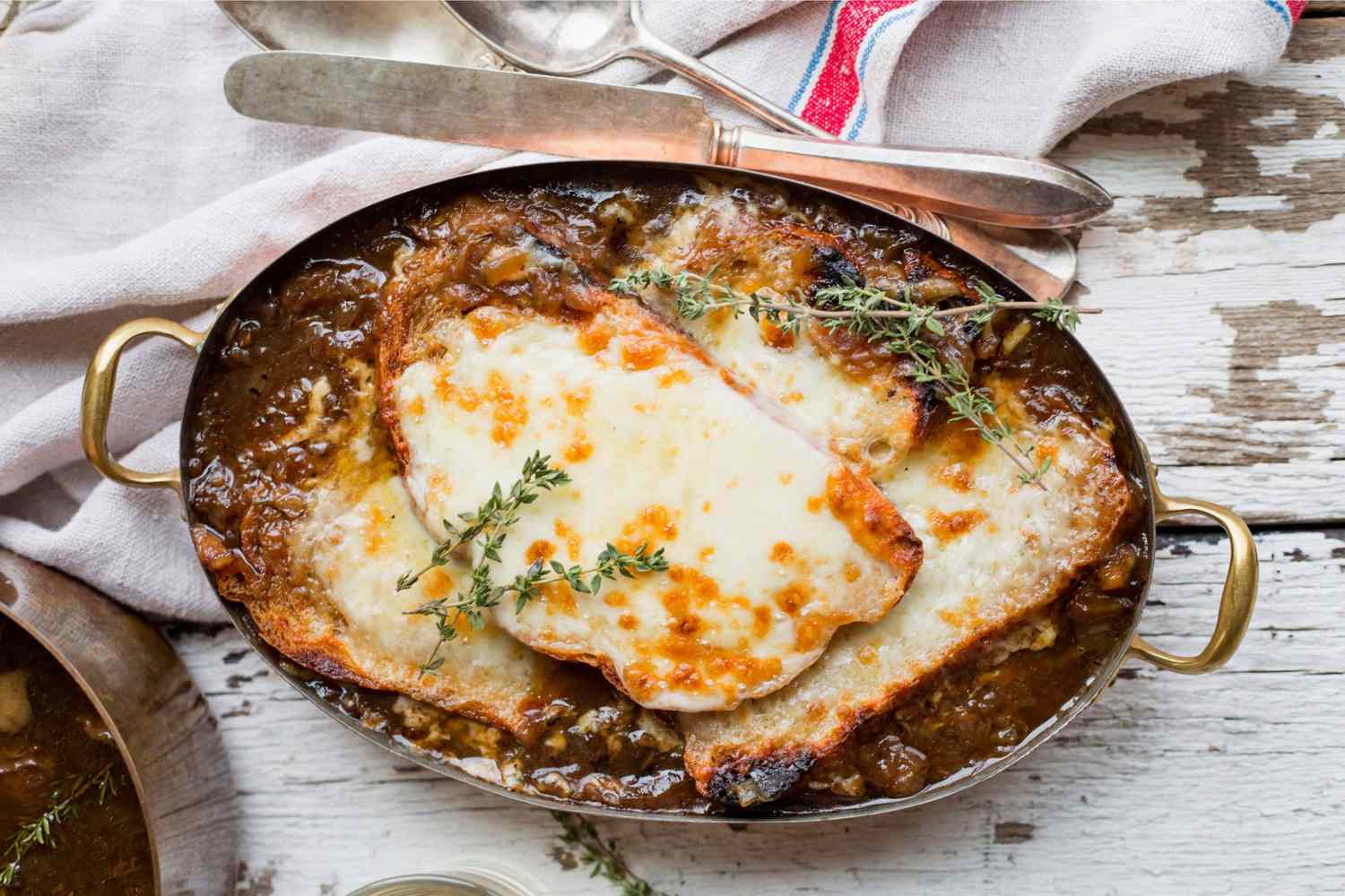 The Ultimate Ribeye French Onion Soup in a baking dish