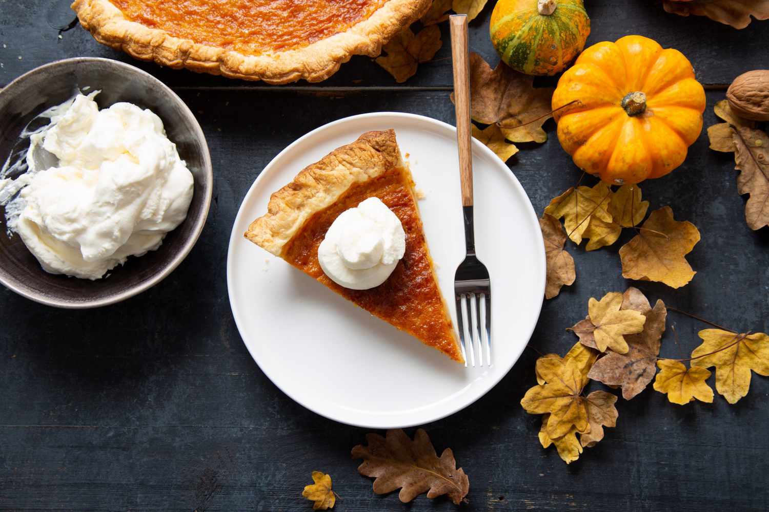 pumpkin pie slice with whipped cream
