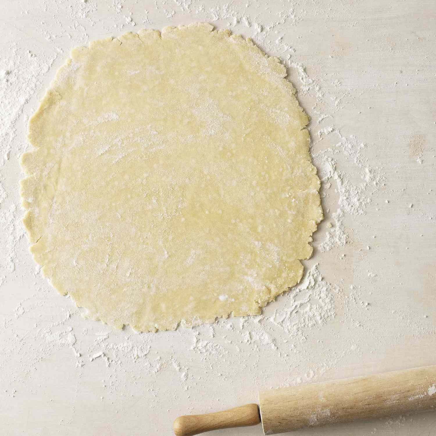 rolled out pastry dough on a countertop