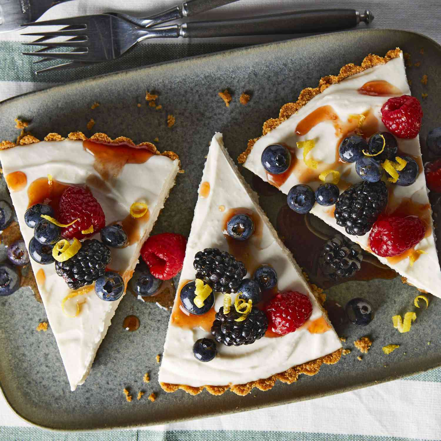 cheesecake slices topped with berries
