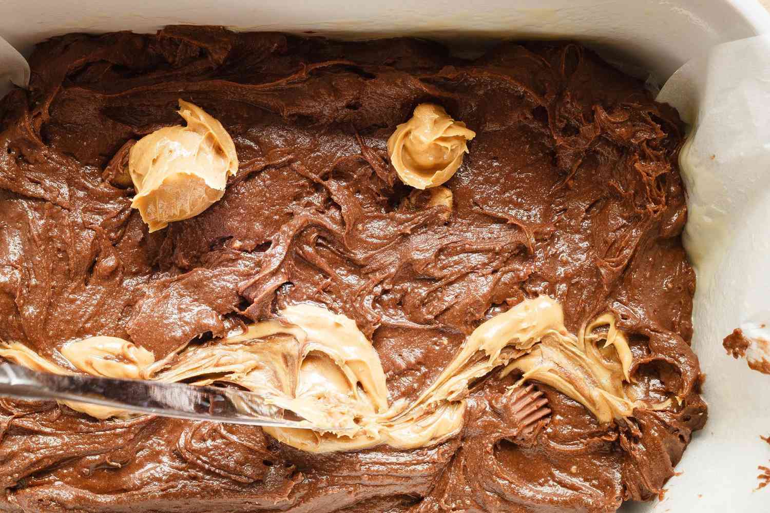 swirling peanut butter into brownie mix