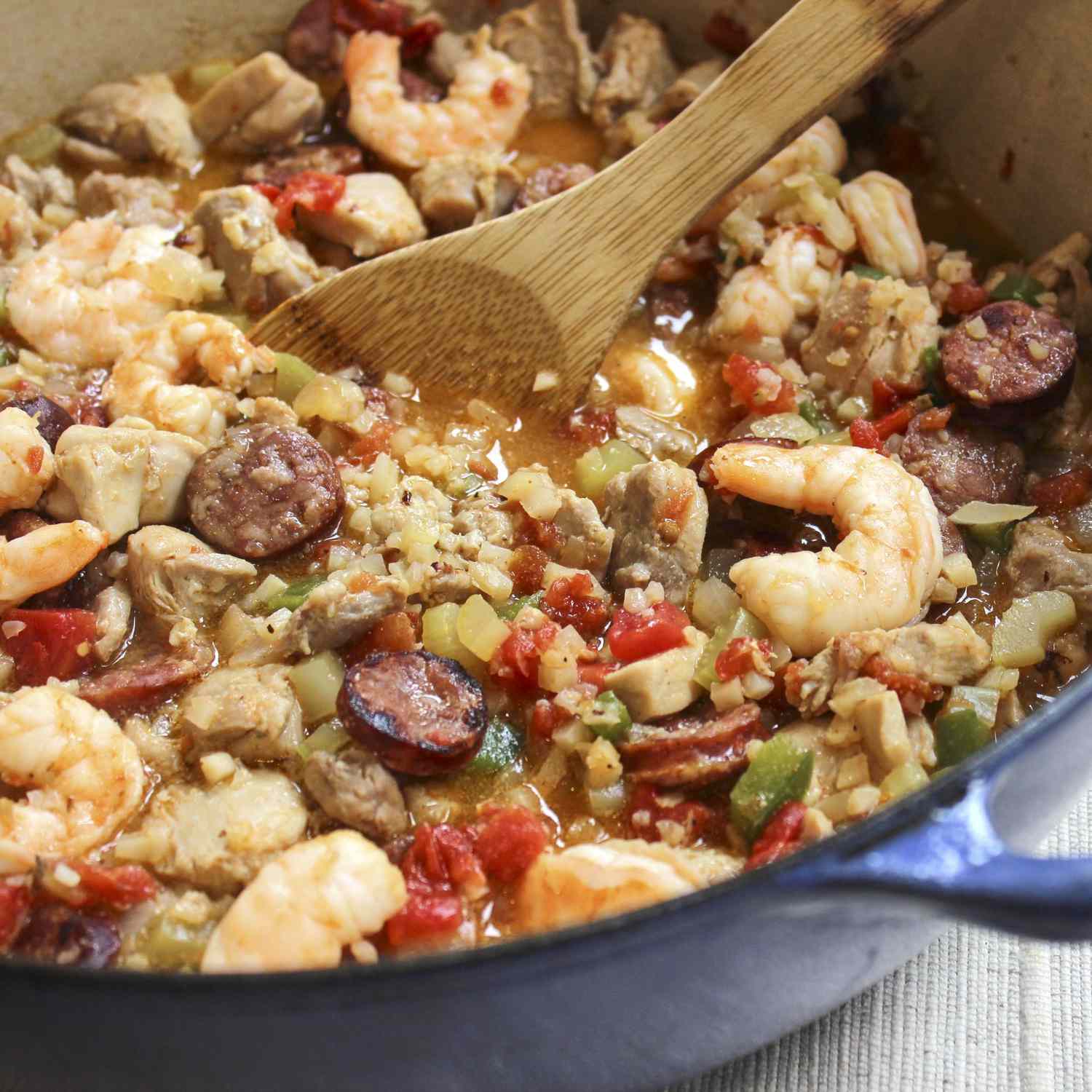 A close-up on dutch oven filled with Jambalaya