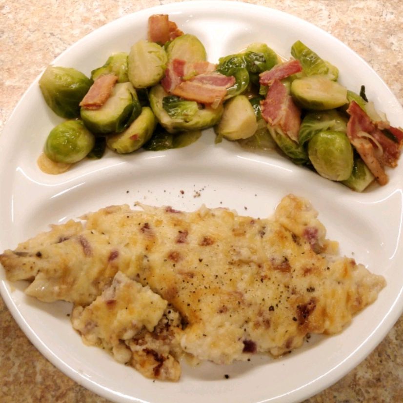 baked au gratin haddock served with Brussels sprouts