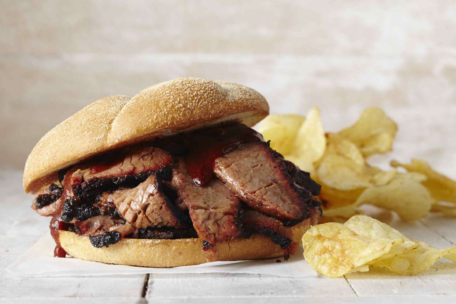 beef brisket on sandwich with chips