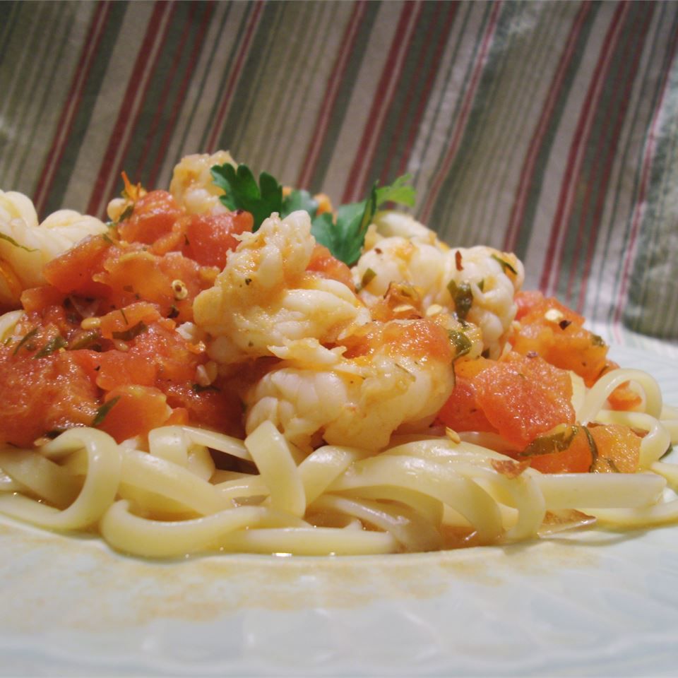 <p>Upgrade your standard tomato and shrimp pasta to a whole new level by adding a generous helping of crushed chili flakes, garlic, and Italian red wine for depth of flavor. Toss with linguine or tagliatelle pasta which are both a good thickness to hold the sauce; garnish with freshly chopped parsley or basil. </p>
                          