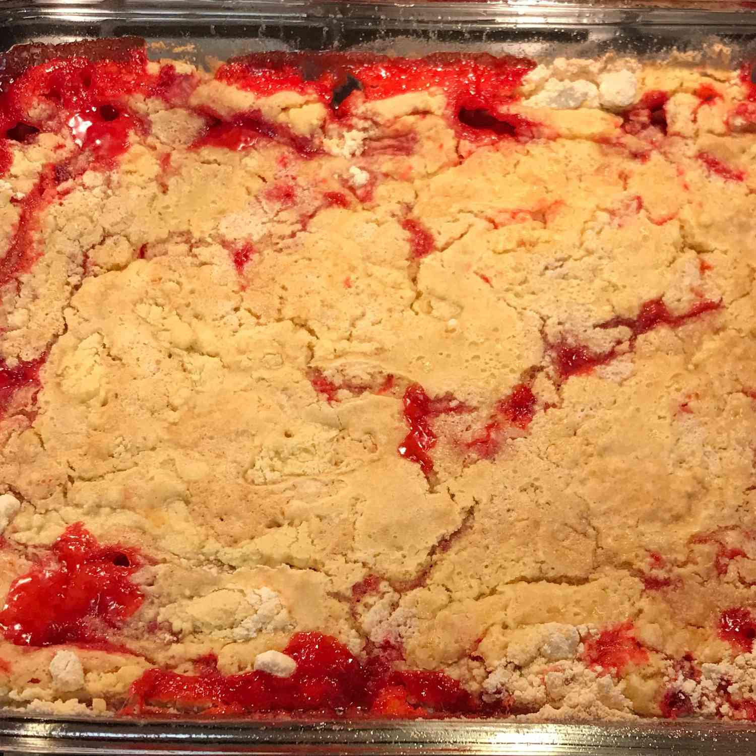 a pyrex dish of strawberry rhubarb dump cake