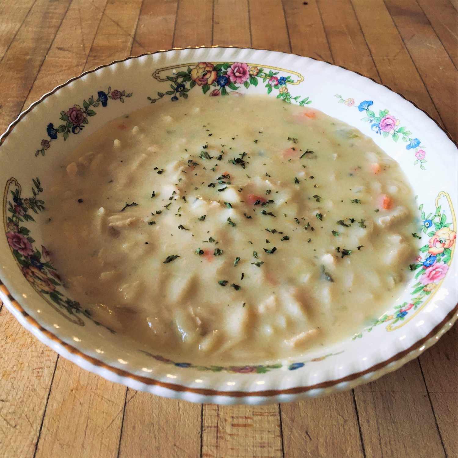 a vintage bowl of Greek egg-lemon soup, aka avgolemono