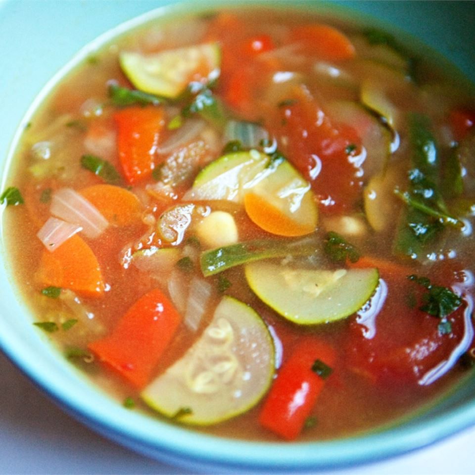 a bowl of quinoa veggie soup