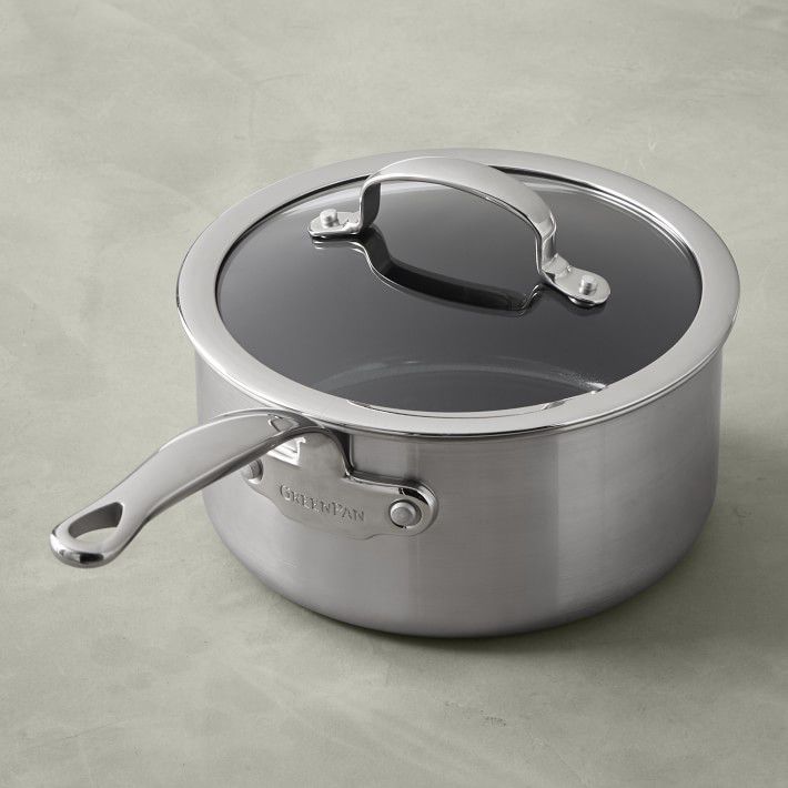 green pan sauce pan with stainless steel exterior and glass cover