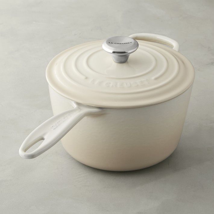 white enameled cast iron saucepan