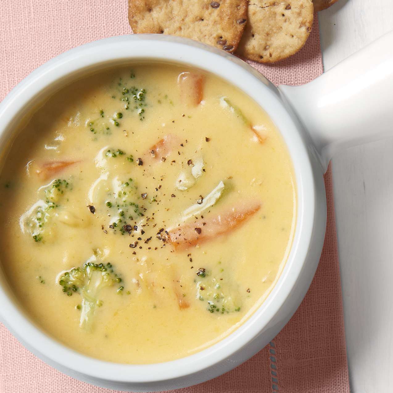 Copycat Panera® Broccoli Cheddar Soup recipe in a white bowl