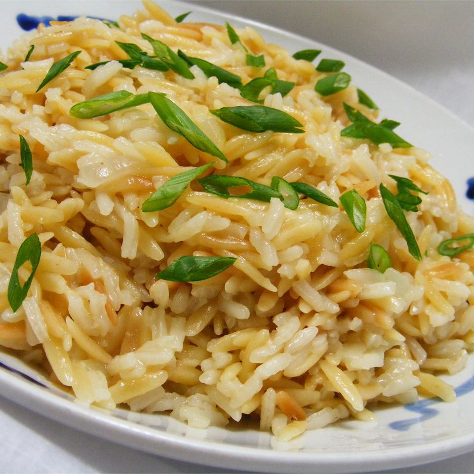 rice pilaf with scallions on plate