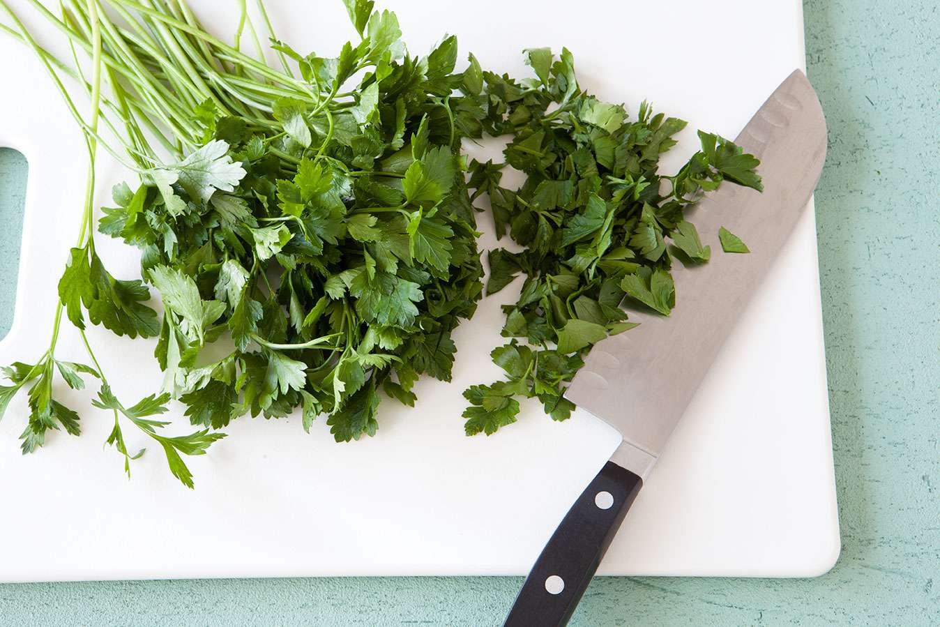 cilantro on cutting board with knife