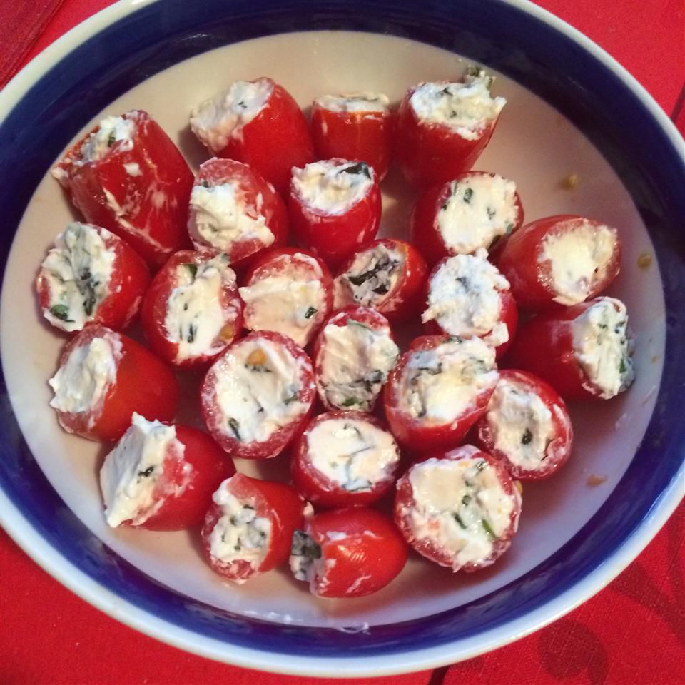 Cherry Tomatoes Filled with Goat Cheese in a white and blue bowl