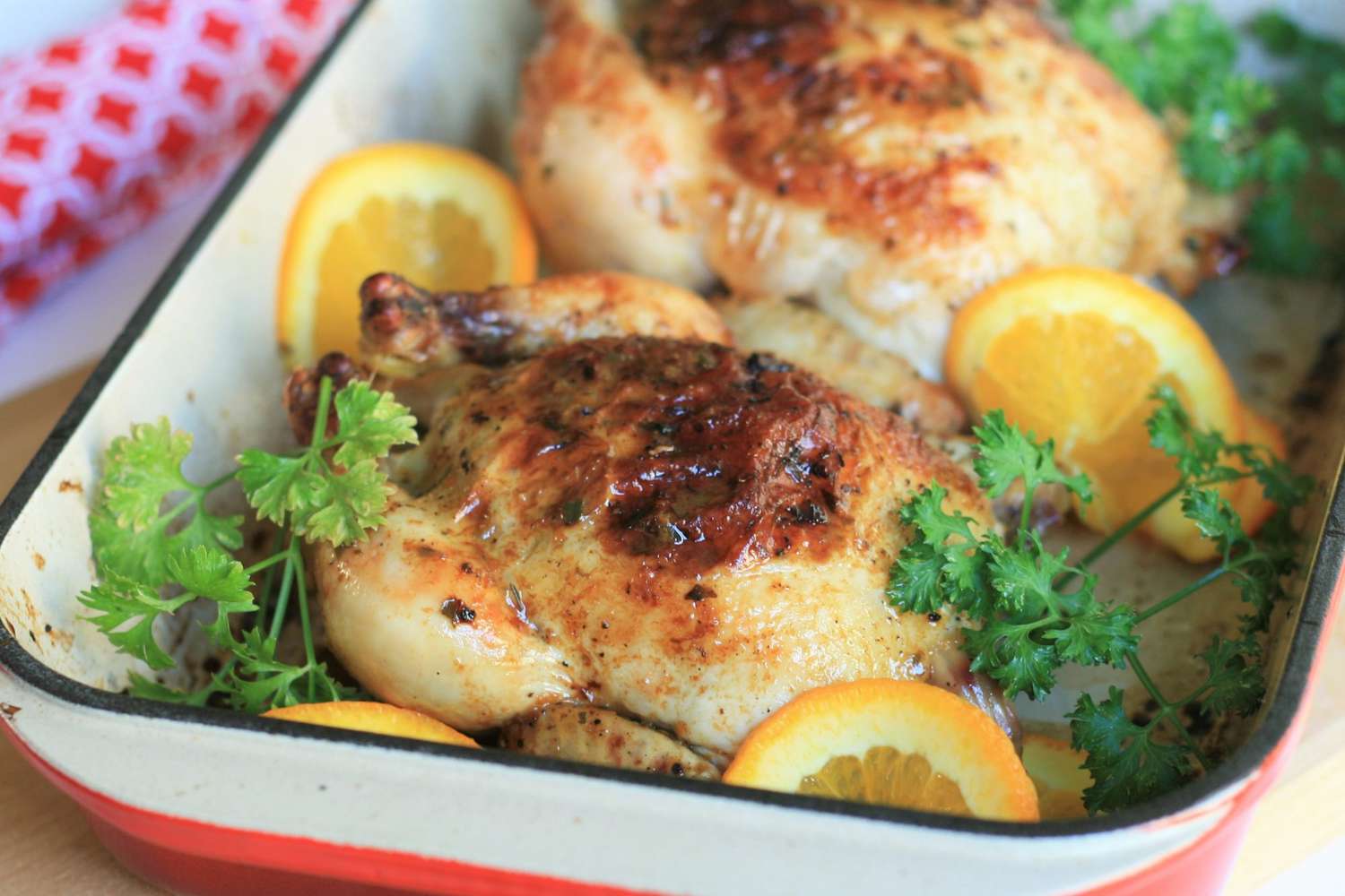 a roasting pan with cornish hens
