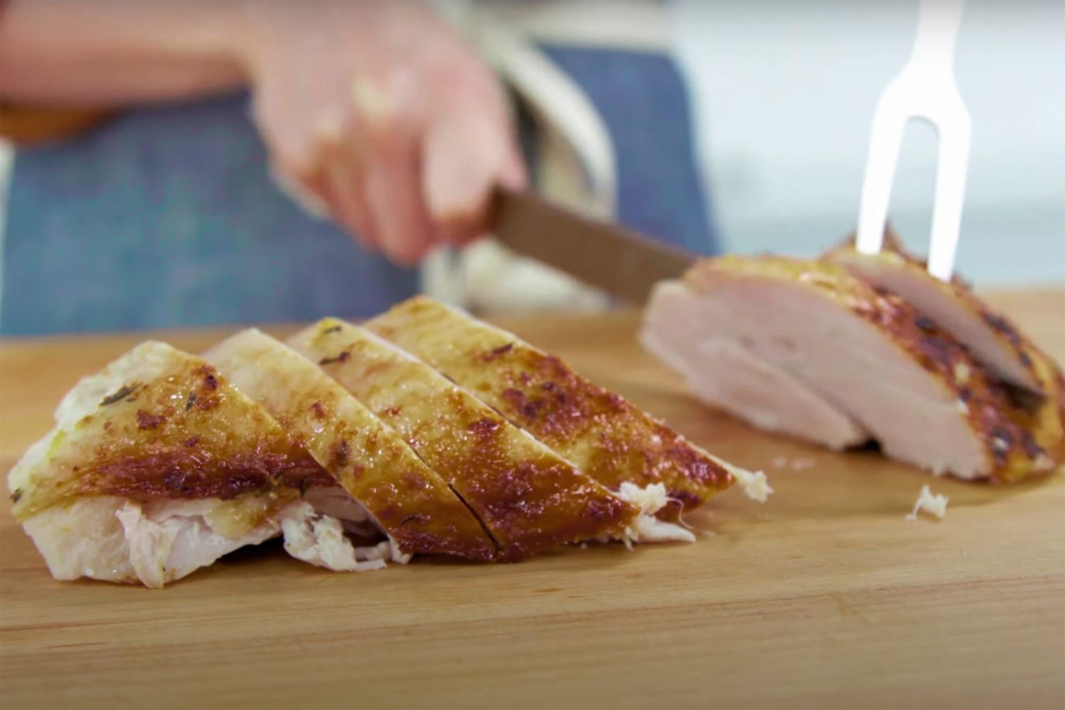 turkey breast sliced on cutting board