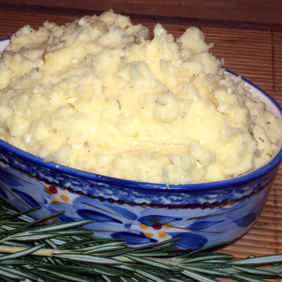 ceramic dish with mashed potatoes and thyme