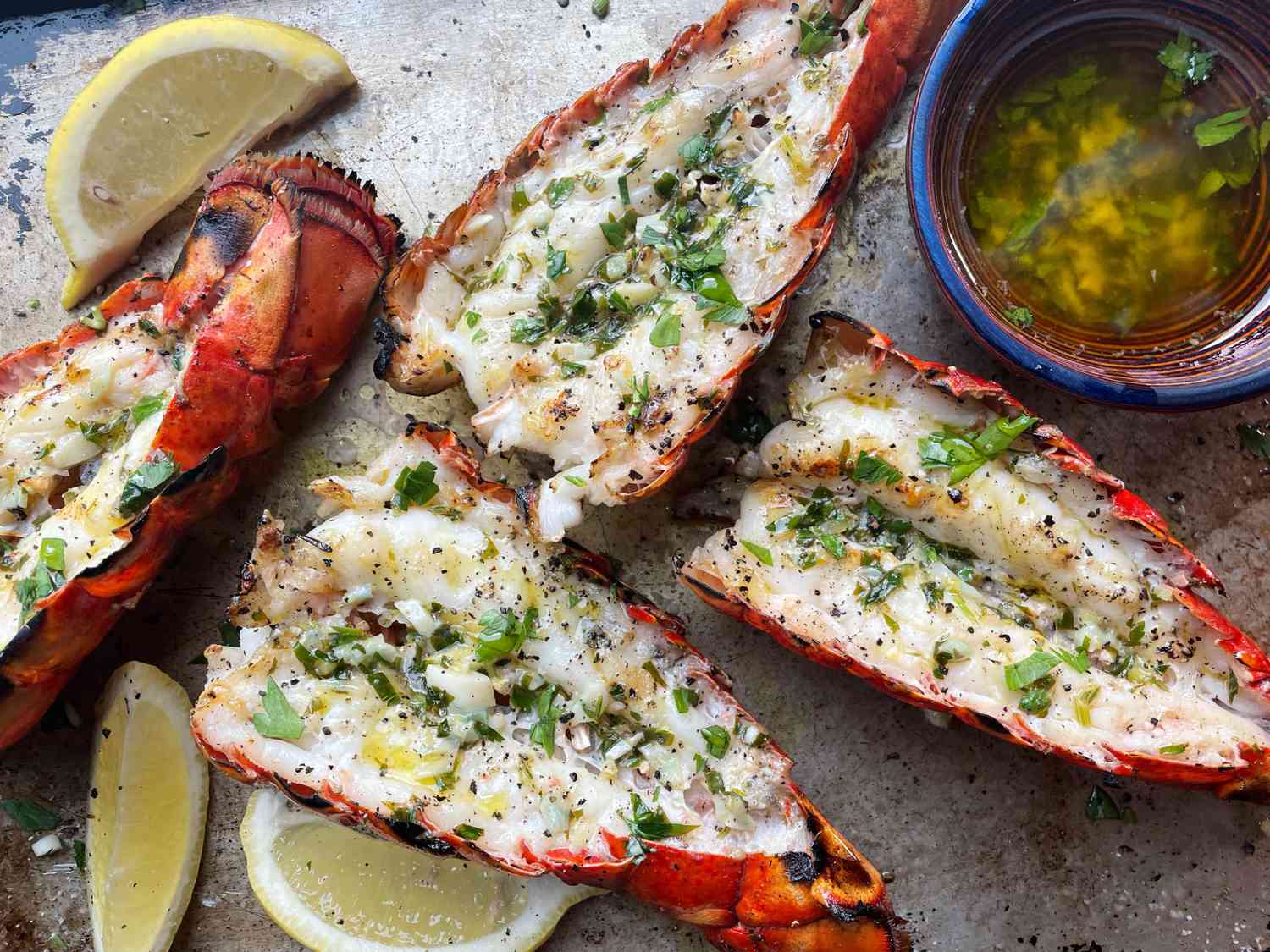 Grilled lobster tails with lemons and garlic butter