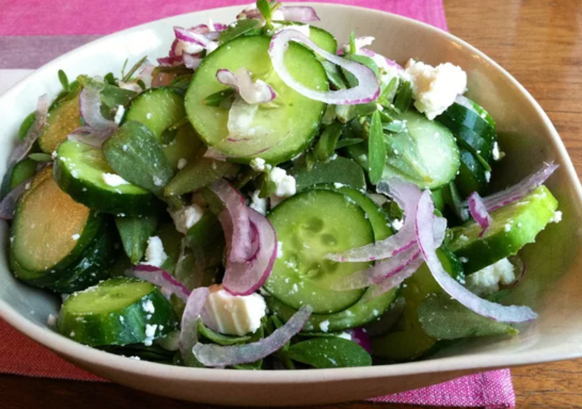 <p>In this refreshing salad recipe, crunchy cucumbers and thinly sliced onions are tossed with fresh purslane, feta cheese, olive oil, and vinegar. </p>
                          