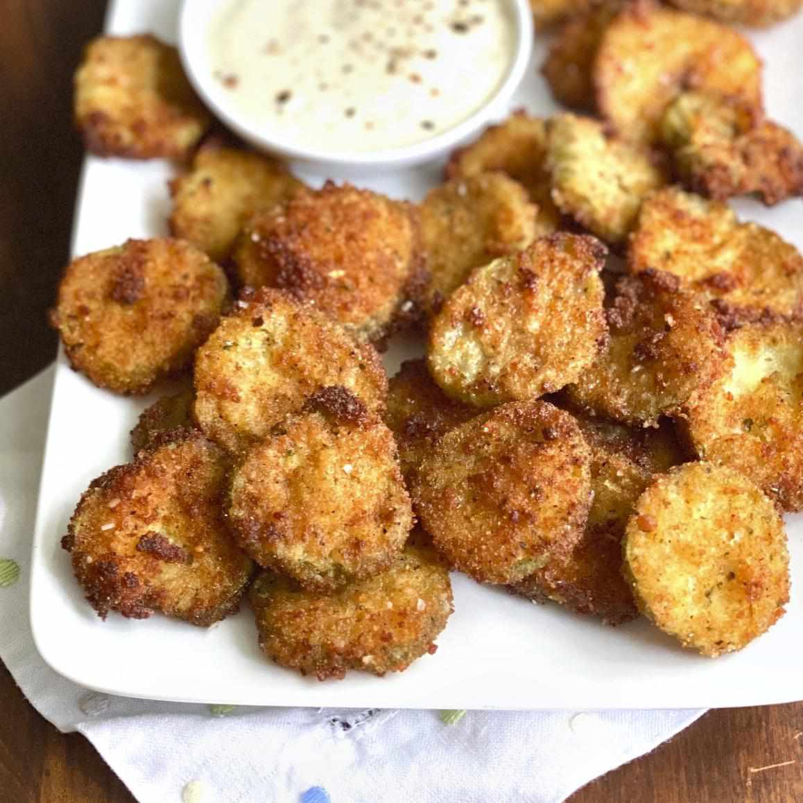 Super Easy and Spicy Fried Pickles on a white plate