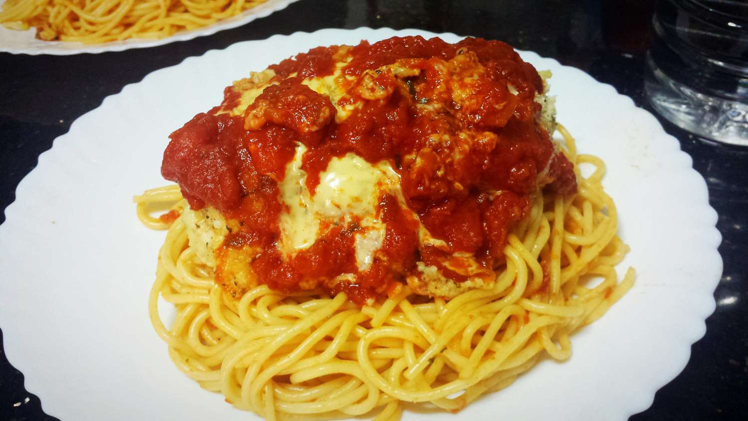 italian stuffed chicken breast over spaghetti