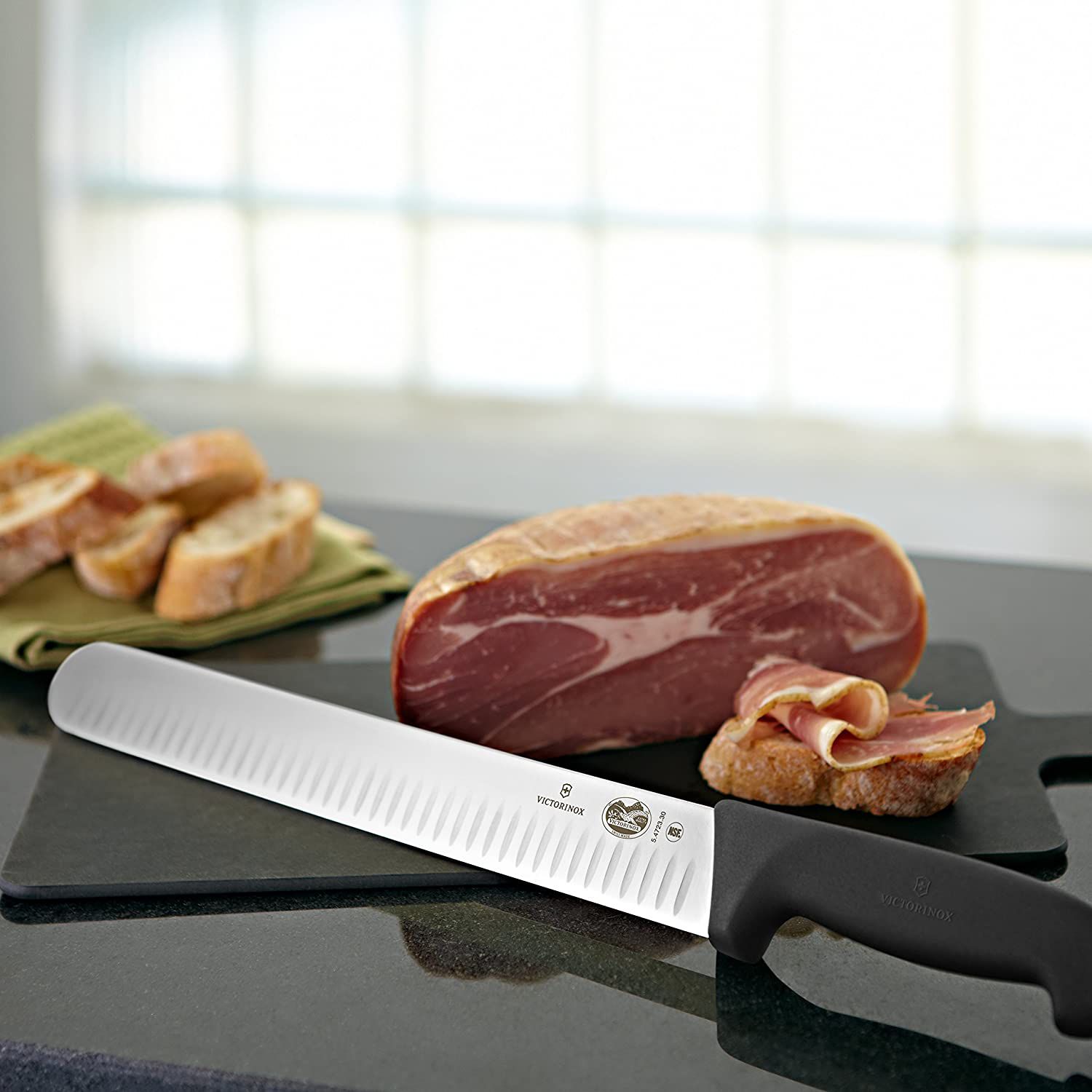 slicing knife next to cured meat