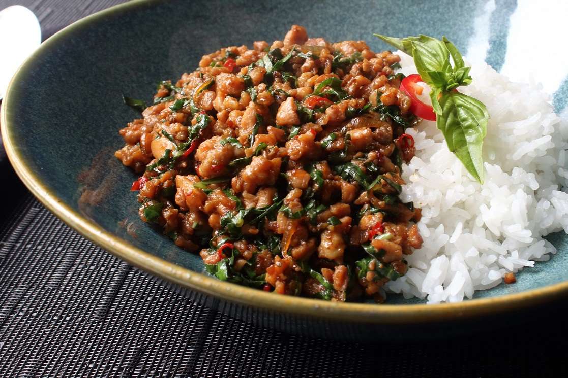 Spicy Thai Basil Chicken (Pad Krapow Gai) served in a bowl with rice