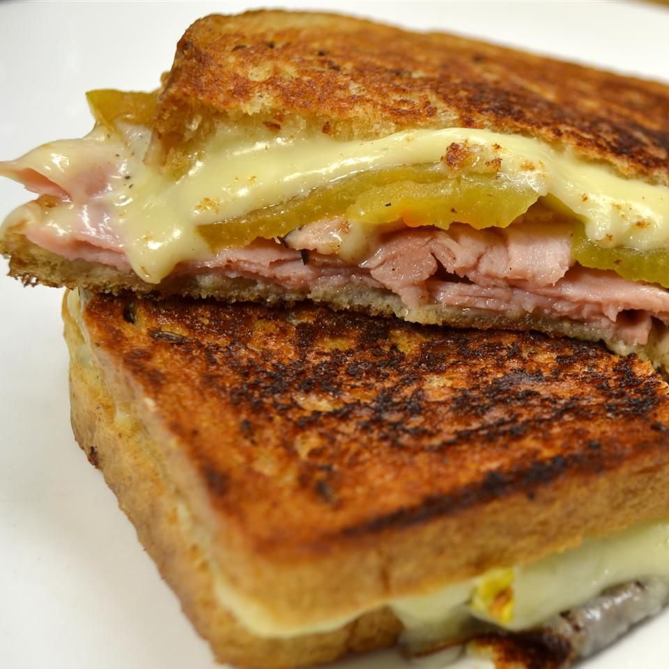 <p>Turn up the heat with a chile-laced grilled cheese sandwich. Layer peppers, ham, and Swiss cheese on rye bread before buttering both sides and toasting in the skillet. </p>
                          