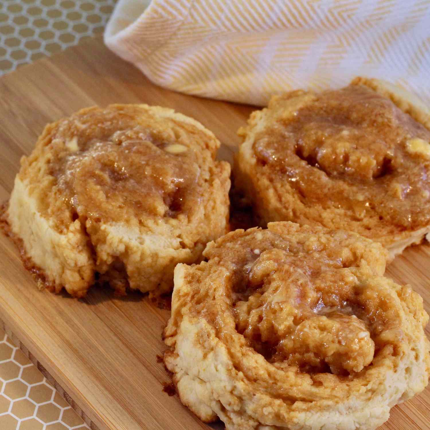 Honey Butter Biscuits on a wooden cutting board