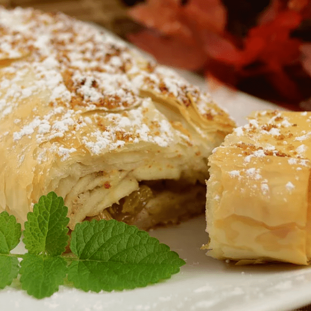 <p>In this classic Austrian apple strudel recipe, homemade wafer-thin pastry encases a filling of ground walnuts, apples, and raisins to retain all the sweet juices while it bakes. It's a lot of work, but well worth the effort for a special holiday dessert.</p>
                          