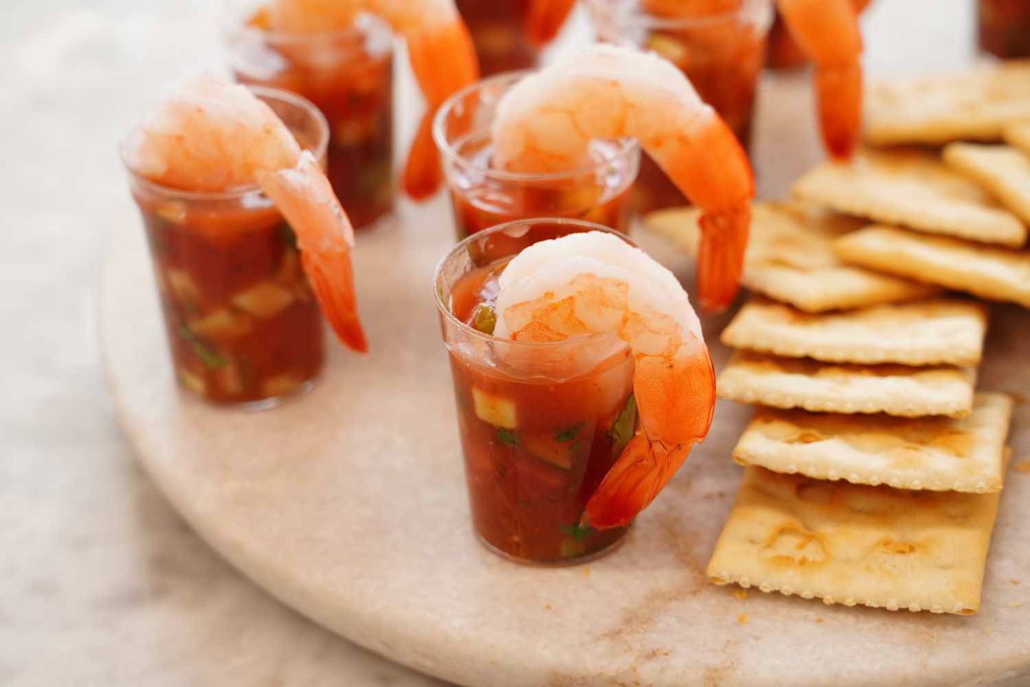 Authentic Mexican Shrimp Cocktail (Coctel de Camarones estilo Mexicano) served in individual shot glasses with saltine crackers on the side